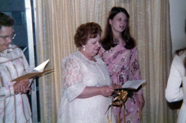 Julie_205.jpg - Grandma Jutras and Lorriane.  Grandma Jutras is holding a copy of the wedding ceremony written by Mom.