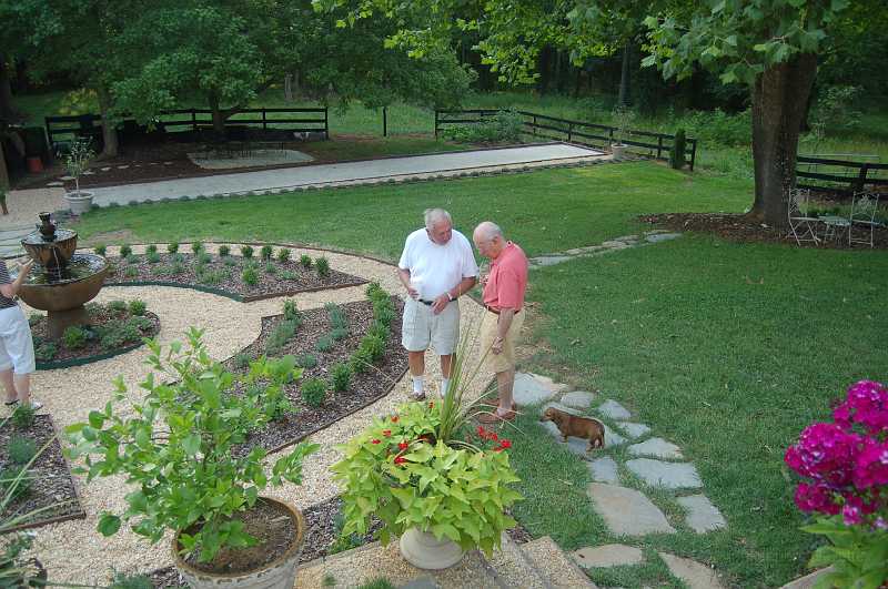 Tonys_06-24-06_004.JPG - Tony & Bill Reed solving the world's problems -- or at least strategizing on how to defeat Josh & Bill C at bocce.