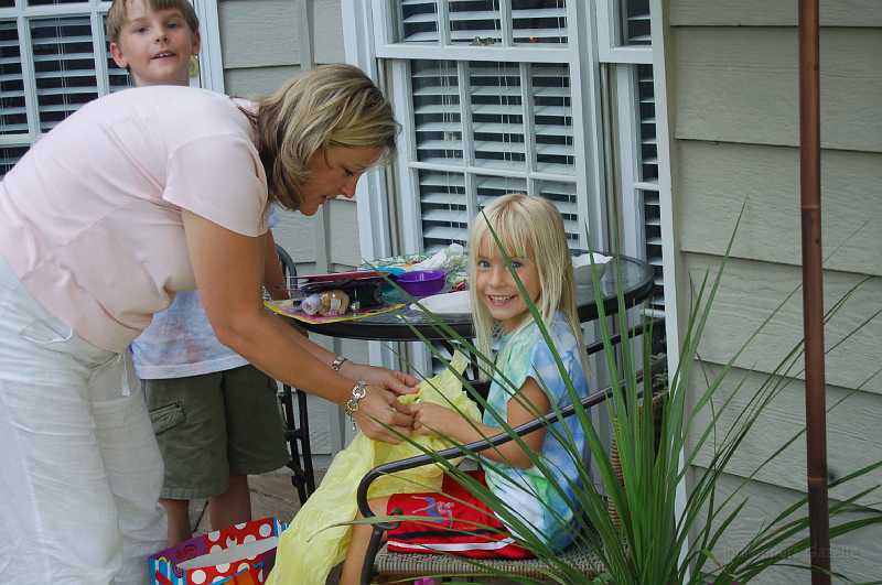 AbbysBirthday_2006_007.JPG - Mom & Abby opening one of her presents ... with assistance by Chace.