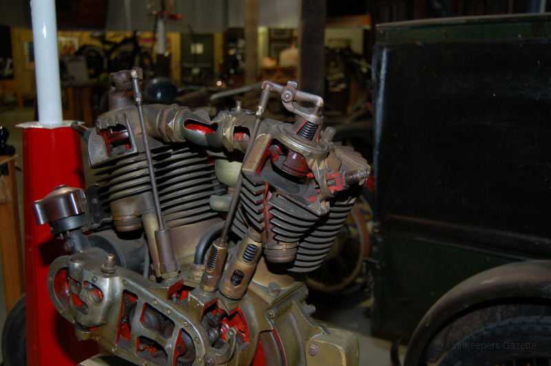 wheelsThruTime0014.JPG - A cut away "pocket valve" Harley-Davidson motor, showing the intake & exhaust valves in a pocket at the side of the combustion chamber.  The exhaust valve is directly actuated by a push rod running against the cam; the intake valve is indirectly actuated via the external rocker arm on top of the cylinder.